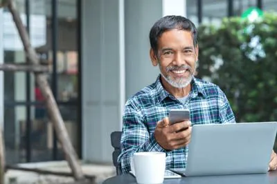 man scheduling a dental appointment at Scott Condie Dentistry in Gilbert, AZ