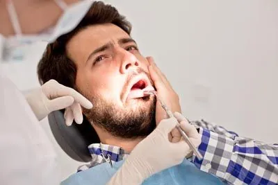 patient at the dentist due to tooth pain