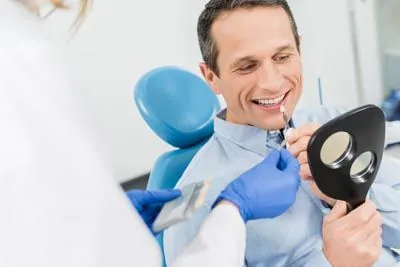 patient picking a color for his new dental veneers