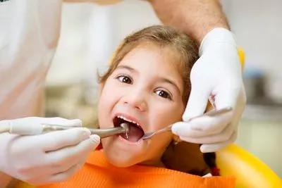 young patient getting her teeth cleaned at Scott Condie Dentistry