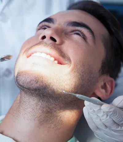 patient getting his teeth cleaned at Scott Condie Dentistry